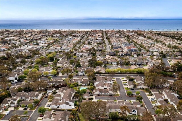 drone / aerial view featuring a water view and a residential view