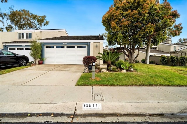 mid-century modern home featuring stucco siding, driveway, a front lawn, and an attached garage