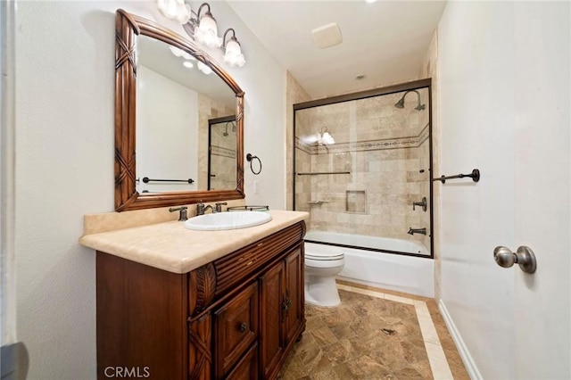 full bath with combined bath / shower with glass door, toilet, and vanity