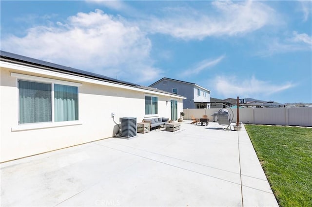 rear view of property featuring an outdoor fire pit, central AC, stucco siding, a yard, and a patio area