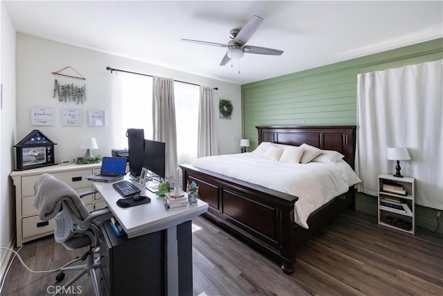 bedroom with a ceiling fan and dark wood-style floors