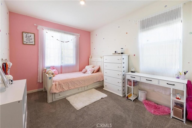 carpeted bedroom with baseboards