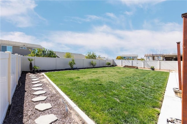 view of yard featuring a fenced backyard