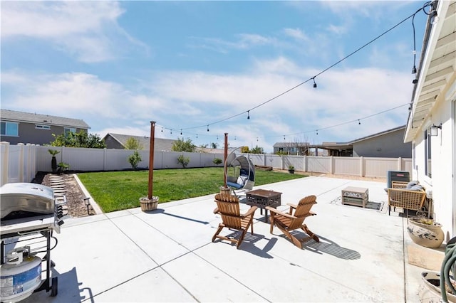 view of patio / terrace with a fenced backyard and an outdoor fire pit