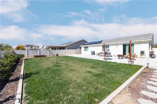 view of yard with a patio, central AC unit, and a fenced backyard