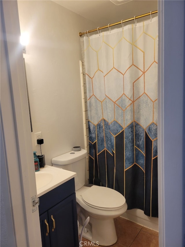 316 Mcbroom Ave, Barstow, CA 92311 - bathroom with tile patterned floors, a shower with curtain, vanity, and toilet