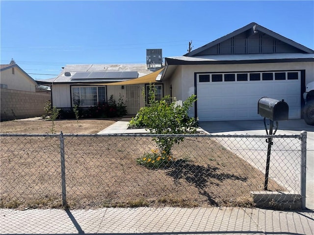 316 Mcbroom Ave, Barstow, CA 92311 - ranch-style house featuring an attached garage, driveway, and roof mounted solar panels