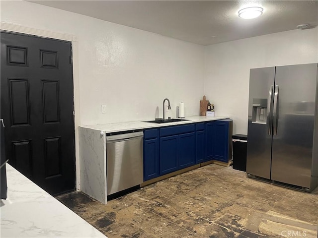 316 Mcbroom Ave, Barstow, CA 92311 - kitchen with stainless steel appliances, blue cabinets, a sink, and light stone counters