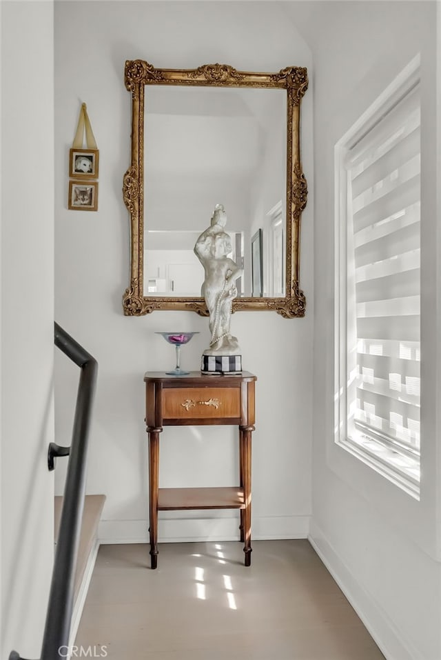 interior space featuring baseboards