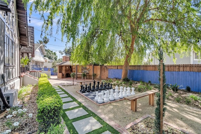 view of yard featuring a patio and fence