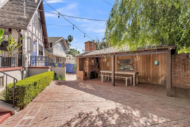 view of patio featuring fence