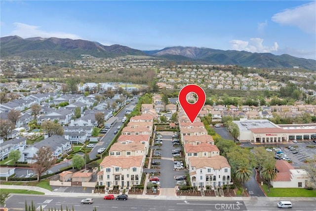 birds eye view of property with a mountain view and a residential view