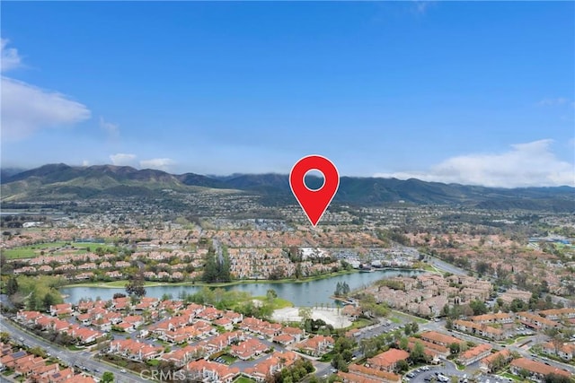 aerial view featuring a residential view and a water and mountain view