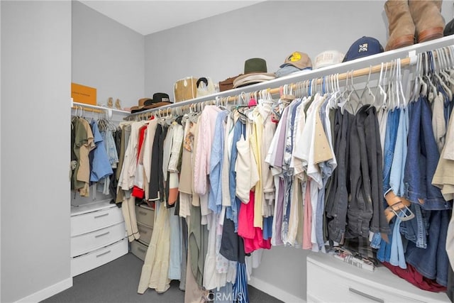 walk in closet featuring carpet floors