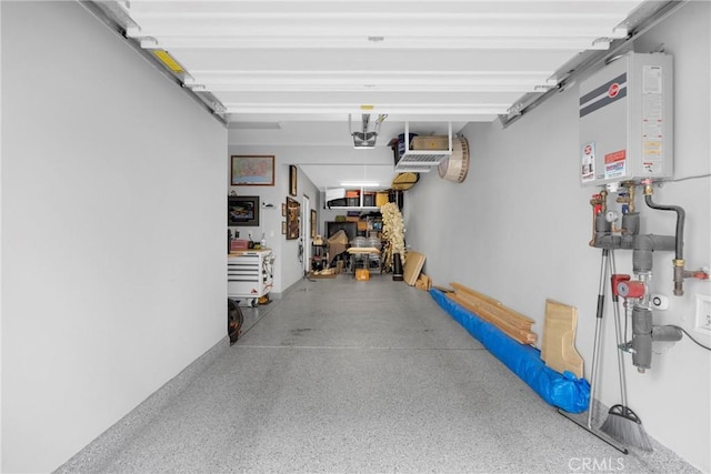 garage with water heater and a garage door opener