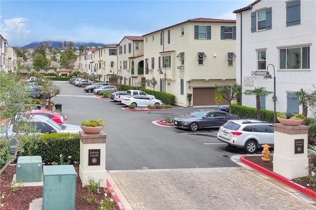 view of street with curbs and a residential view