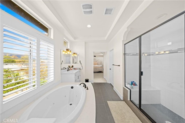 ensuite bathroom featuring a tub with jets, visible vents, ensuite bath, a shower stall, and tile patterned floors