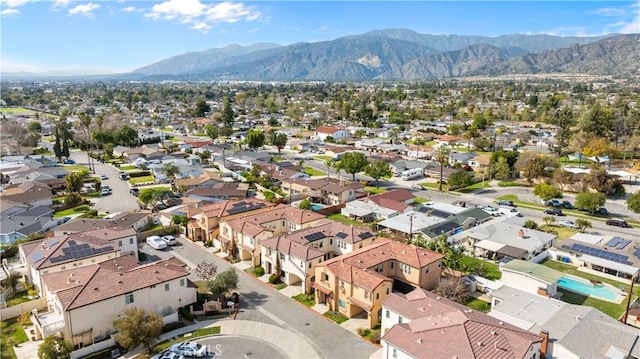 drone / aerial view with a residential view and a mountain view