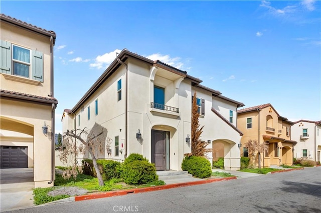 view of front facade with a residential view and stucco siding