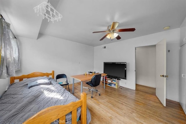 bedroom with ceiling fan and wood finished floors