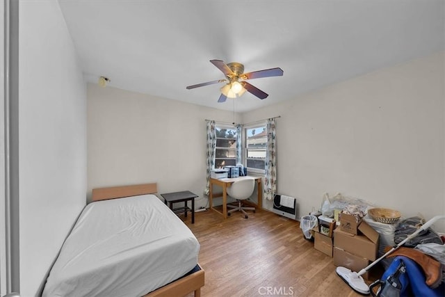 bedroom featuring wood finished floors and ceiling fan