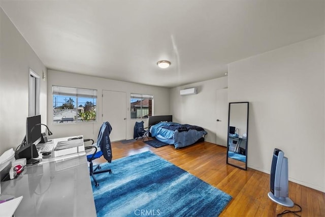 bedroom featuring wood finished floors