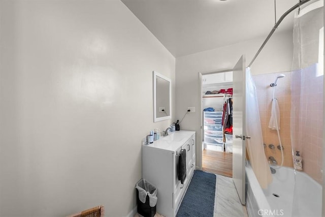 full bathroom featuring shower / bath combo with shower curtain and vanity