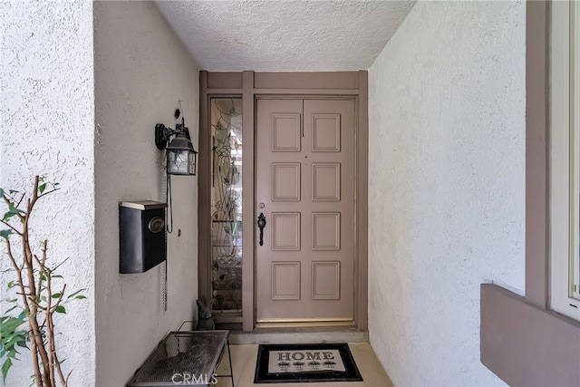 doorway to property with stucco siding