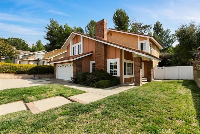 view of front of house featuring driveway, fence, board and batten siding, a front yard, and a chimney