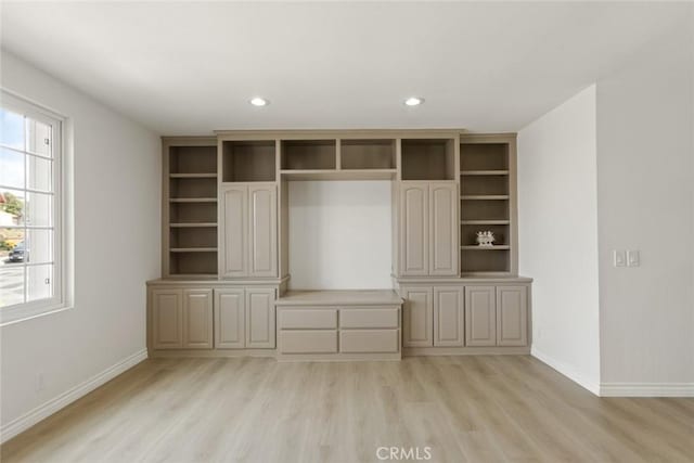 interior space with light wood finished floors, recessed lighting, a closet, and baseboards