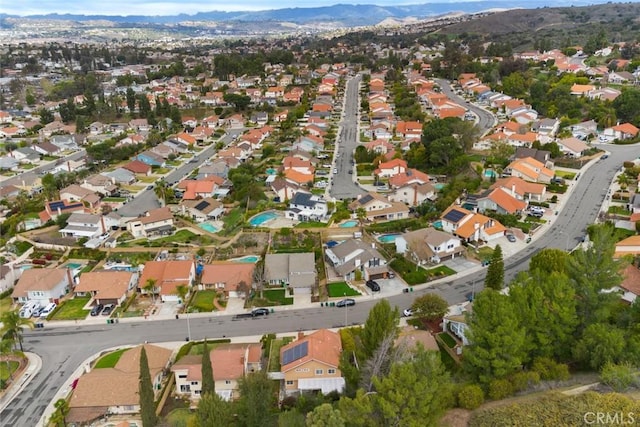 birds eye view of property featuring a mountain view and a residential view