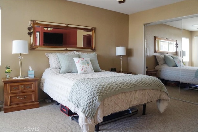 carpeted bedroom featuring a closet