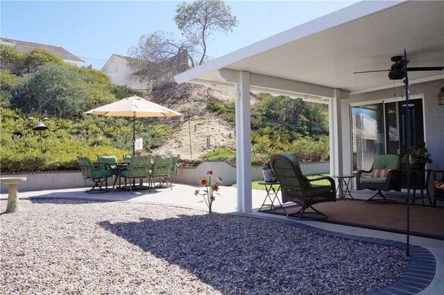 view of patio / terrace featuring outdoor dining area and a ceiling fan