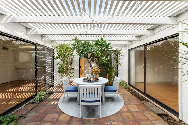 view of patio with outdoor dining area and a pergola