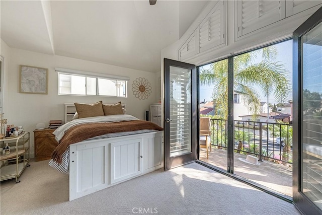 carpeted bedroom featuring access to outside