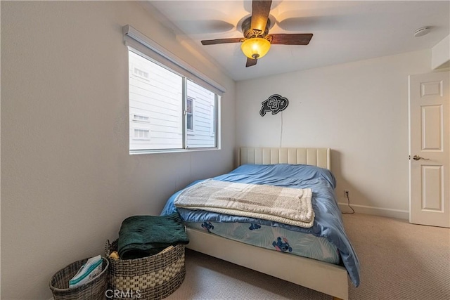 bedroom featuring baseboards, carpet floors, and ceiling fan