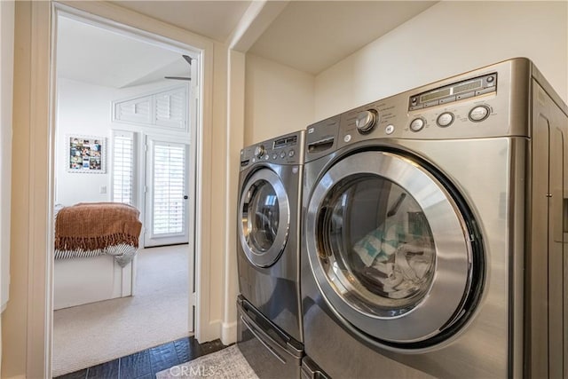 laundry area featuring washer and dryer, carpet floors, and laundry area