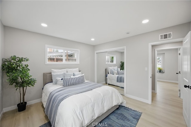 bedroom featuring light wood-style flooring, recessed lighting, and visible vents