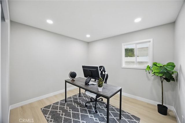 home office with recessed lighting, baseboards, and wood finished floors