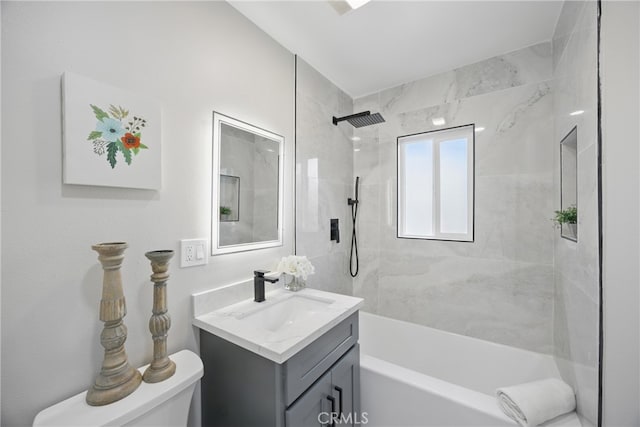 bathroom featuring vanity, bathing tub / shower combination, and toilet