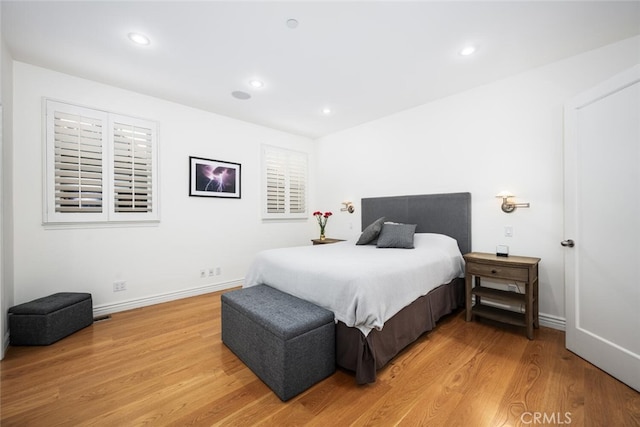 bedroom featuring recessed lighting, light wood-type flooring, and baseboards