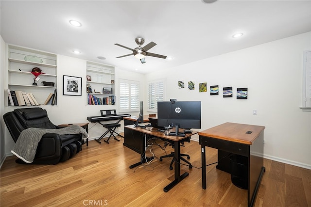 office area featuring light wood finished floors, recessed lighting, baseboards, and a ceiling fan