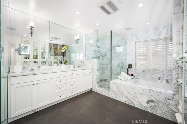 full bathroom featuring visible vents, a marble finish shower, double vanity, tile patterned flooring, and a bath