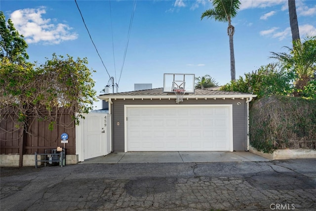 garage featuring fence