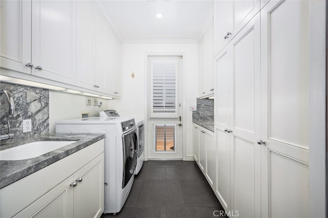 washroom with recessed lighting, cabinet space, ornamental molding, a sink, and independent washer and dryer