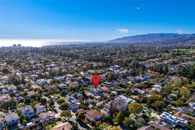 birds eye view of property with a mountain view and a residential view