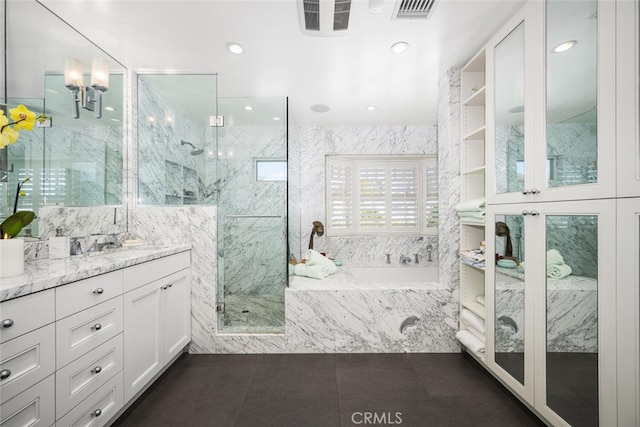 full bath featuring a marble finish shower, visible vents, tile patterned flooring, a garden tub, and vanity