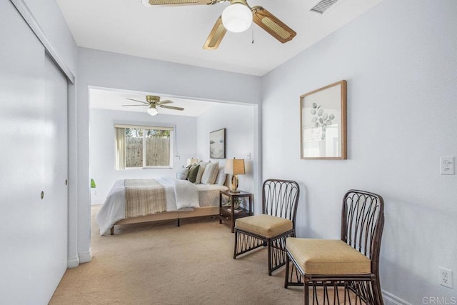 bedroom featuring visible vents, carpet, a closet, and ceiling fan