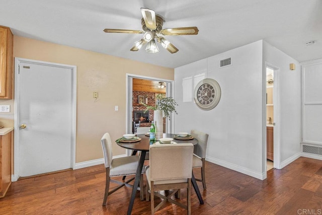 dining area featuring ceiling fan, visible vents, and wood finished floors