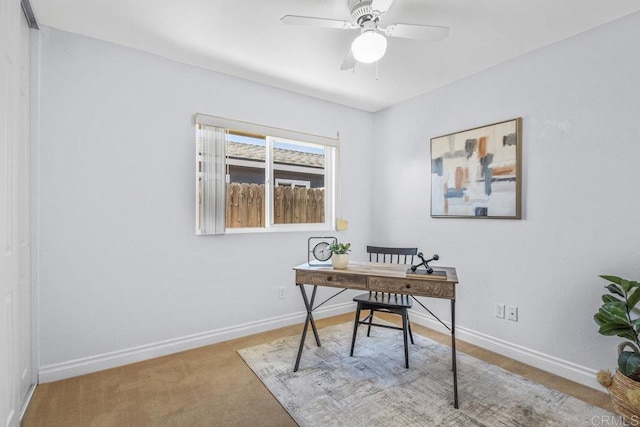 home office with ceiling fan, carpet, and baseboards